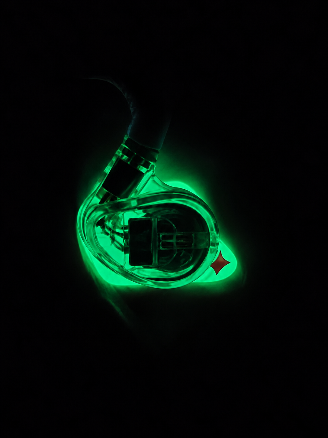 Night Glow custom eartip glowing in the dark with an IEM